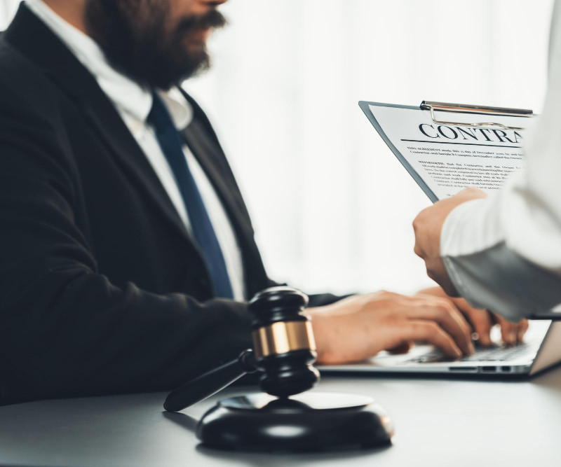Business litigation attorney reviewing case documents in Las Vegas courtroom