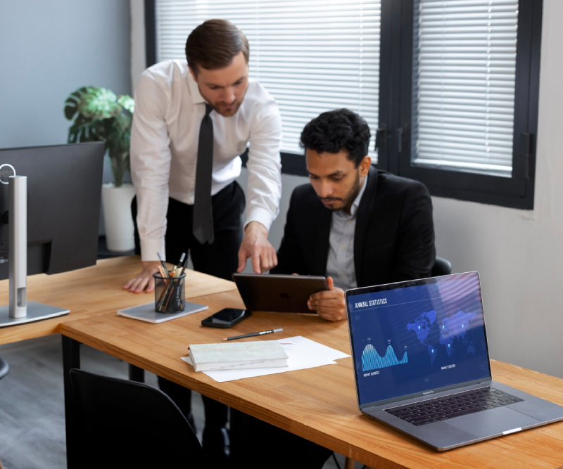 Business person looking at finance graphs