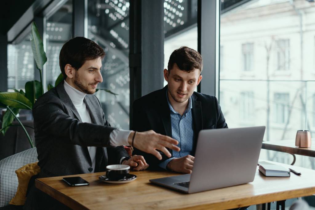 Business owner and intellectual property attorney reviewing trademarks, copyrights, trade secrets, and brand protection strategies