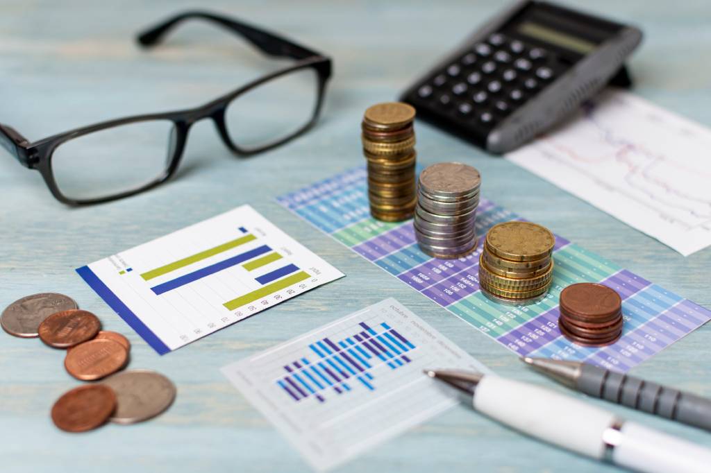 Business executives reviewing investment documents, securities filings, investor agreements, and regulatory compliance requirements.