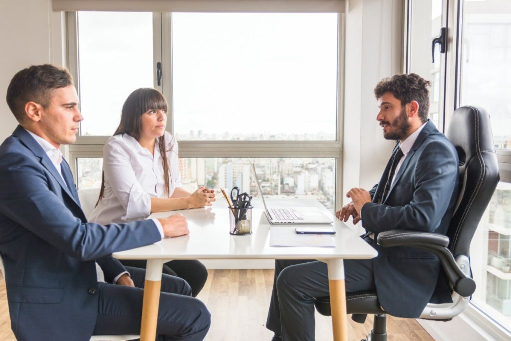 Nevada business partners meeting with a business attorney to resolve an ownership dispute.