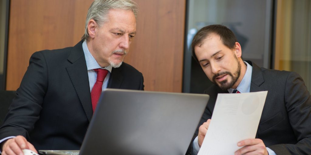 Nevada business attorney helping a business owner complete the legal process of dissolving an LLC.
