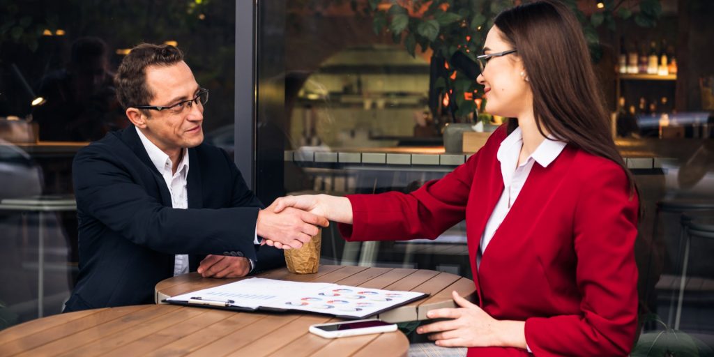 Business owner reviewing a franchise agreement with a Nevada business attorney before purchasing a franchise.