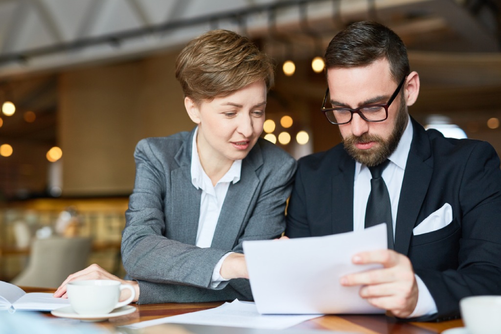 Entrepreneur examining a Franchise Disclosure Document (FDD) before investing in a Nevada franchise.
