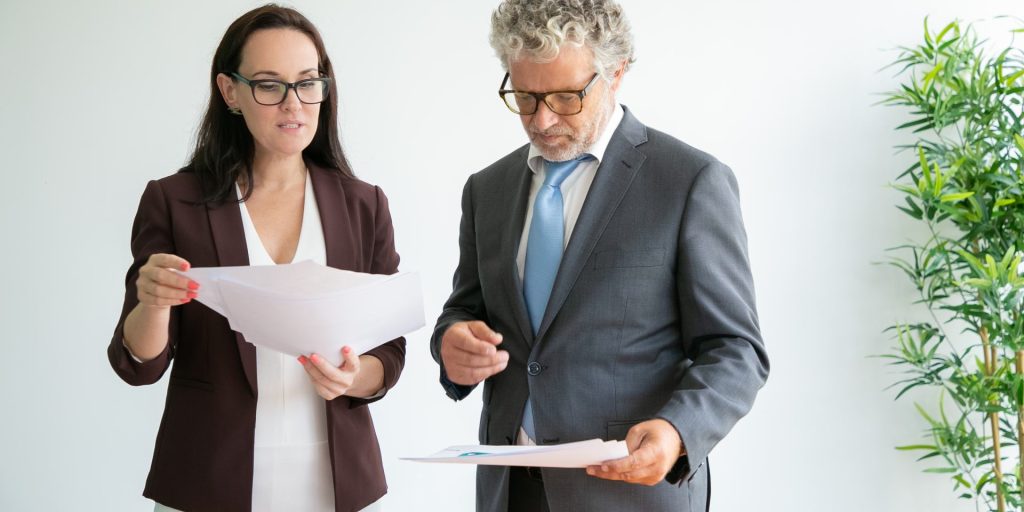 Nevada business owner reviewing an independent contractor agreement with a business attorney.