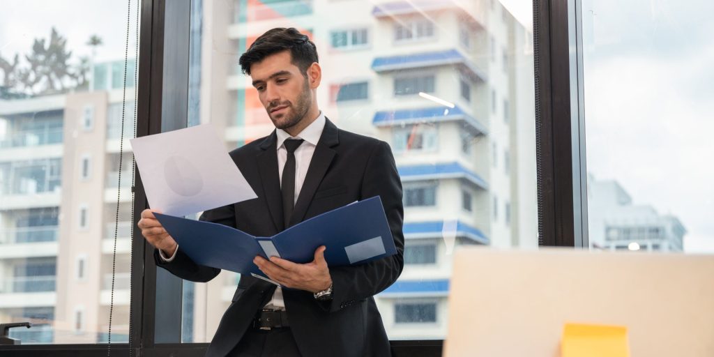 Business owner completing documents to convert a sole proprietorship into a Nevada LLC.