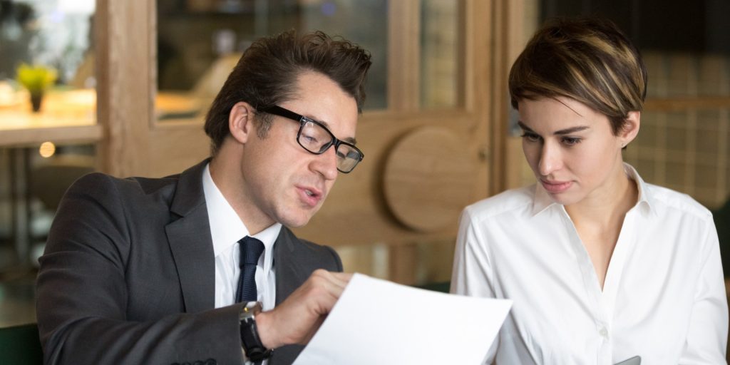 Nevada business owner reviewing a supplier contract with a business attorney.