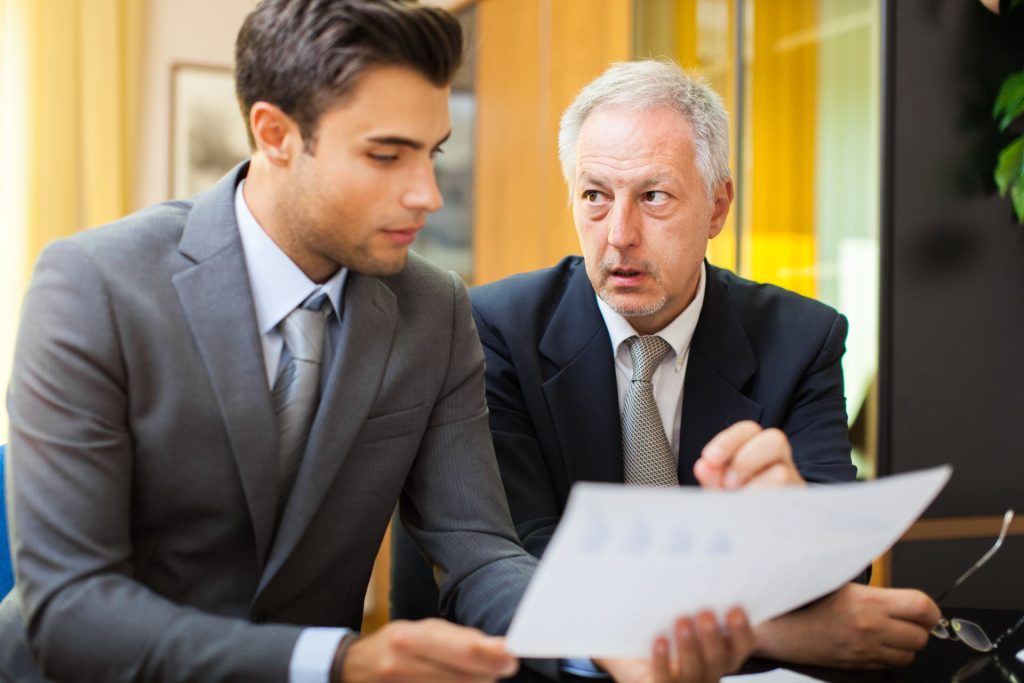 Business owner discussing employee and independent contractor classification with an attorney