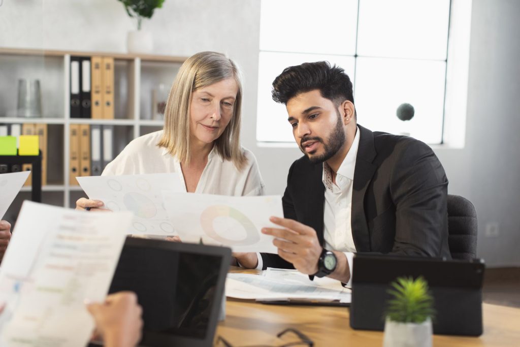Business owner reviewing IRS employee and independent contractor classification factors with HR