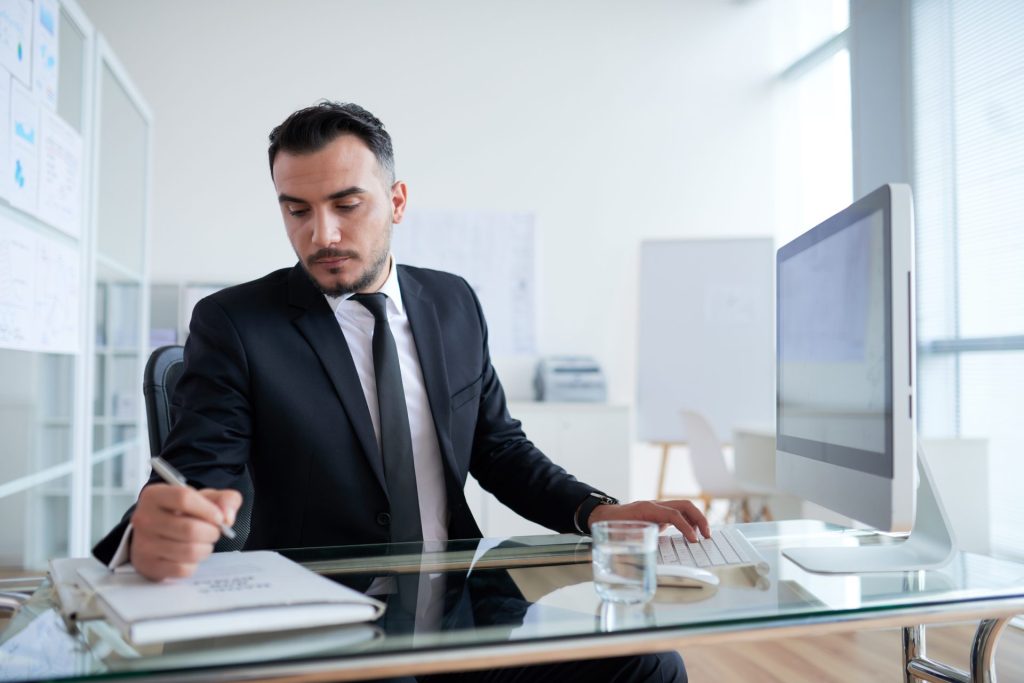 Business professional reviewing LLC compliance requirements for two states