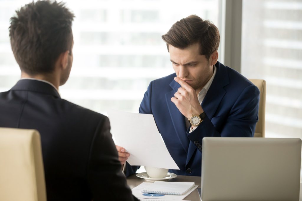 Attorney reviewing a business contract with Nevada business owner