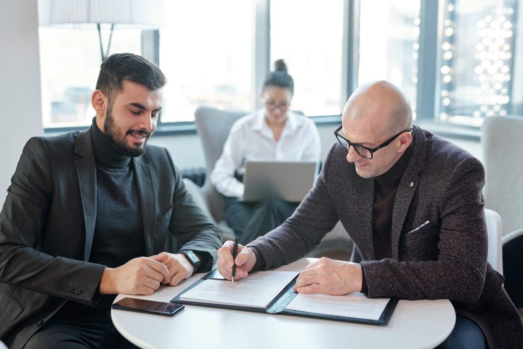 Attorney reviewing legal requirements for merging two businesses in Nevada