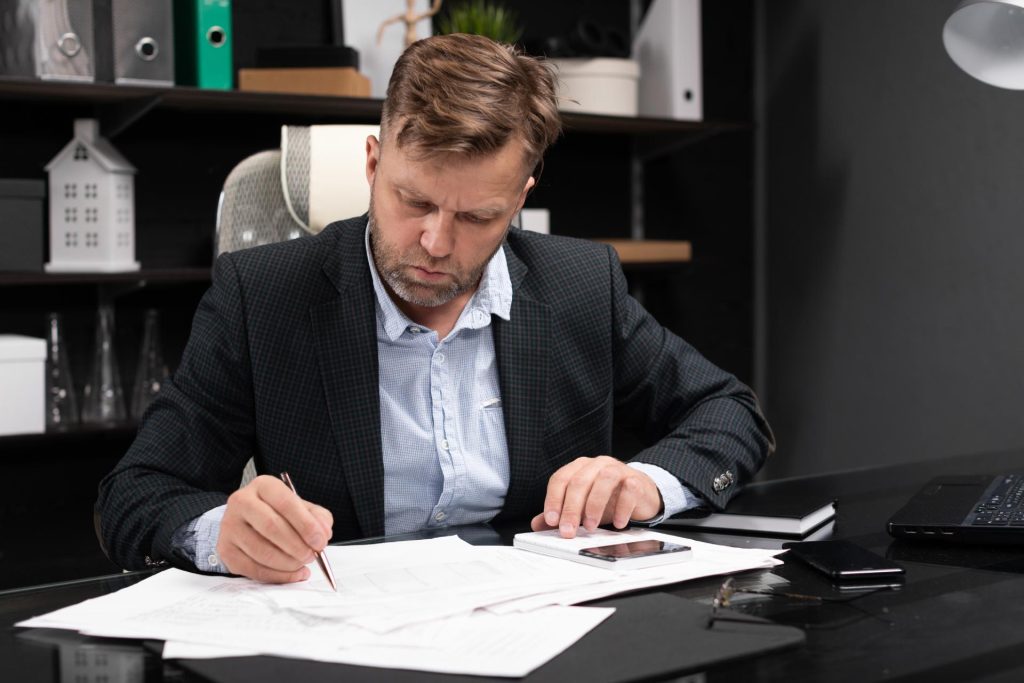 Nevada M&A attorney reviewing escrow and indemnification provisions in an acquisition agreement