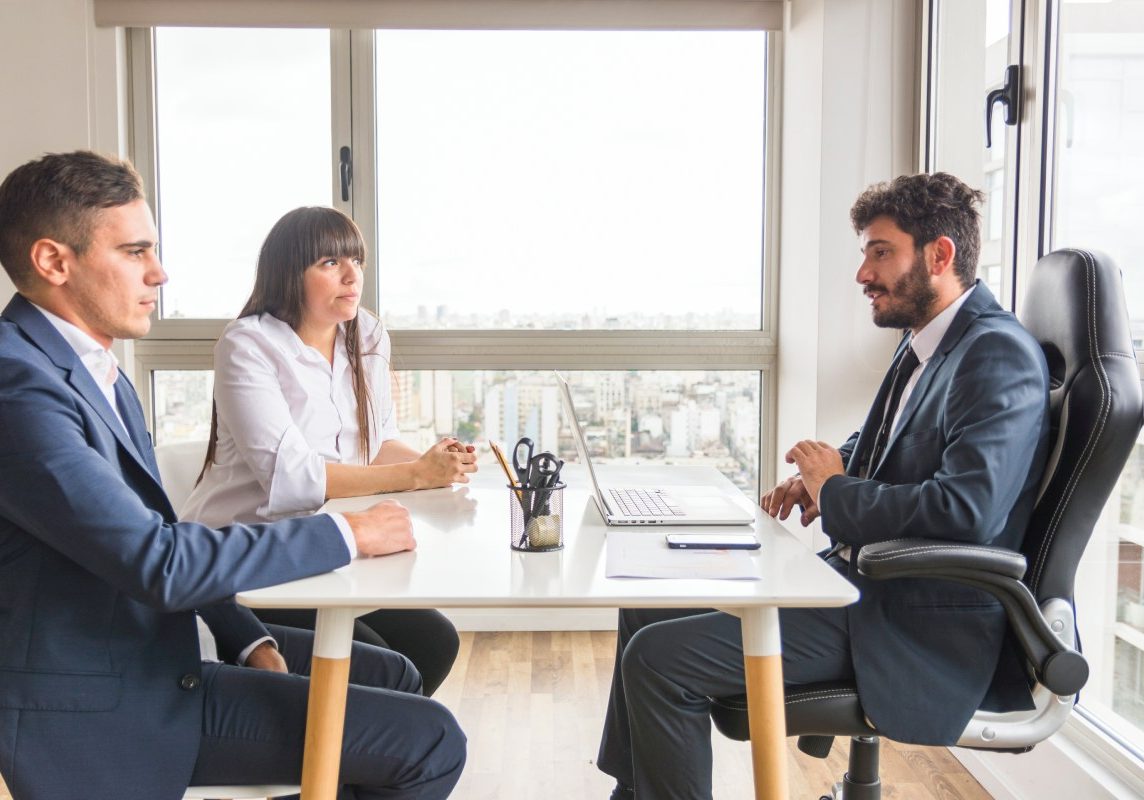 Nevada business partners meeting with a business attorney to resolve an ownership dispute.