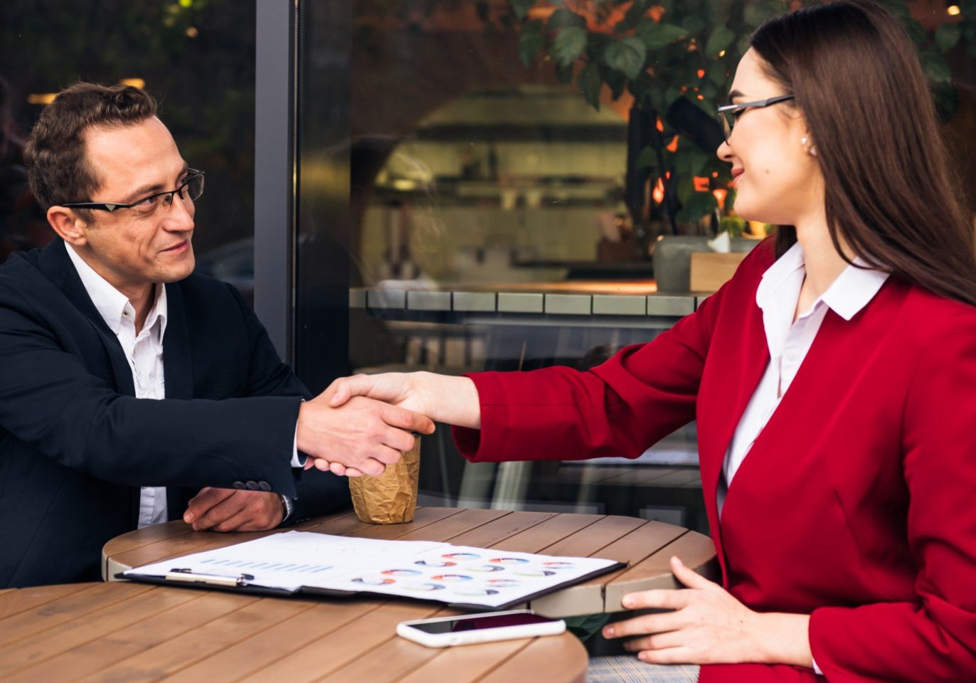 Business owner reviewing a franchise agreement with a Nevada business attorney before purchasing a franchise.