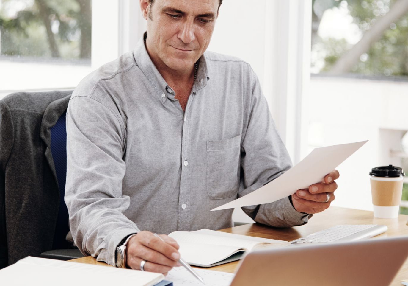 Nevada business owner reviewing employee and independent contractor classification documents