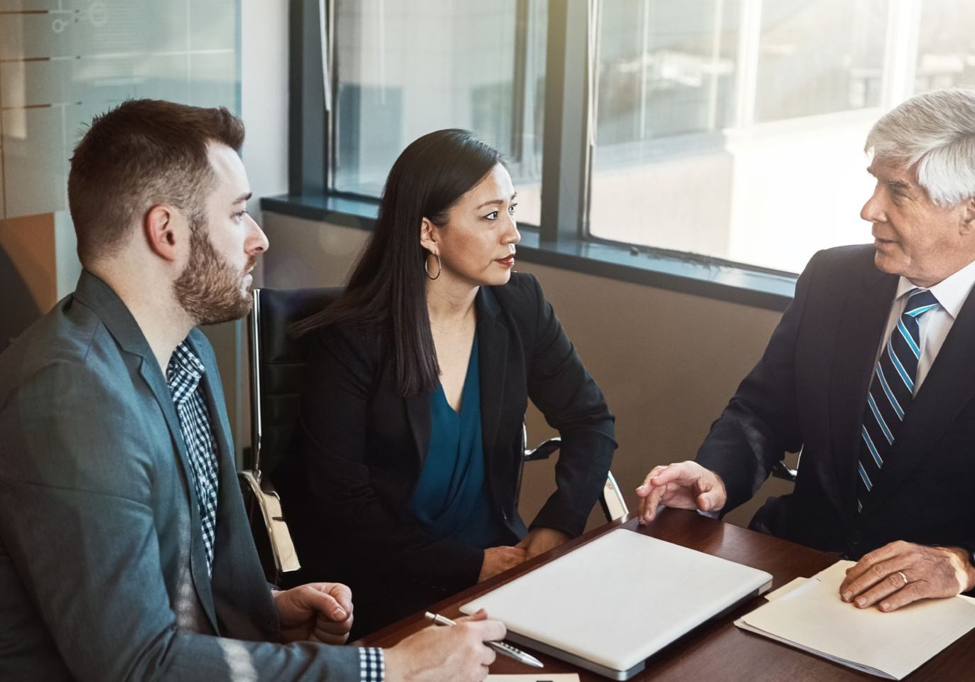 Nevada business owner meeting with a trademark attorney to protect a company brand from infringement.